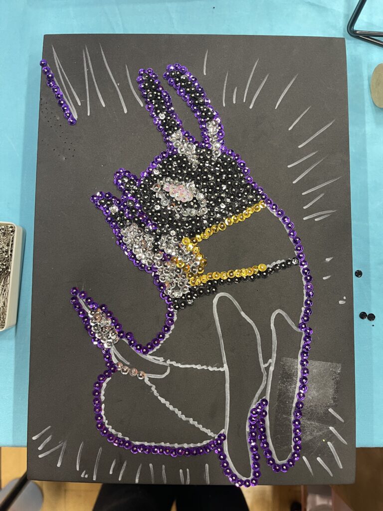sequin art of a bee with antennae and head completed